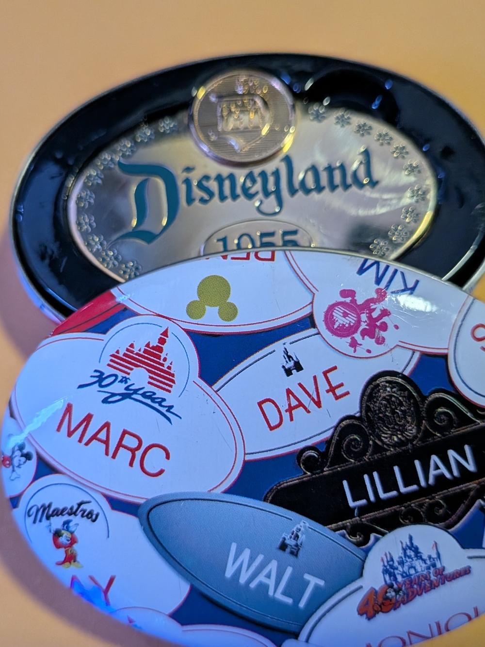 Disney collectible name badge And Tin